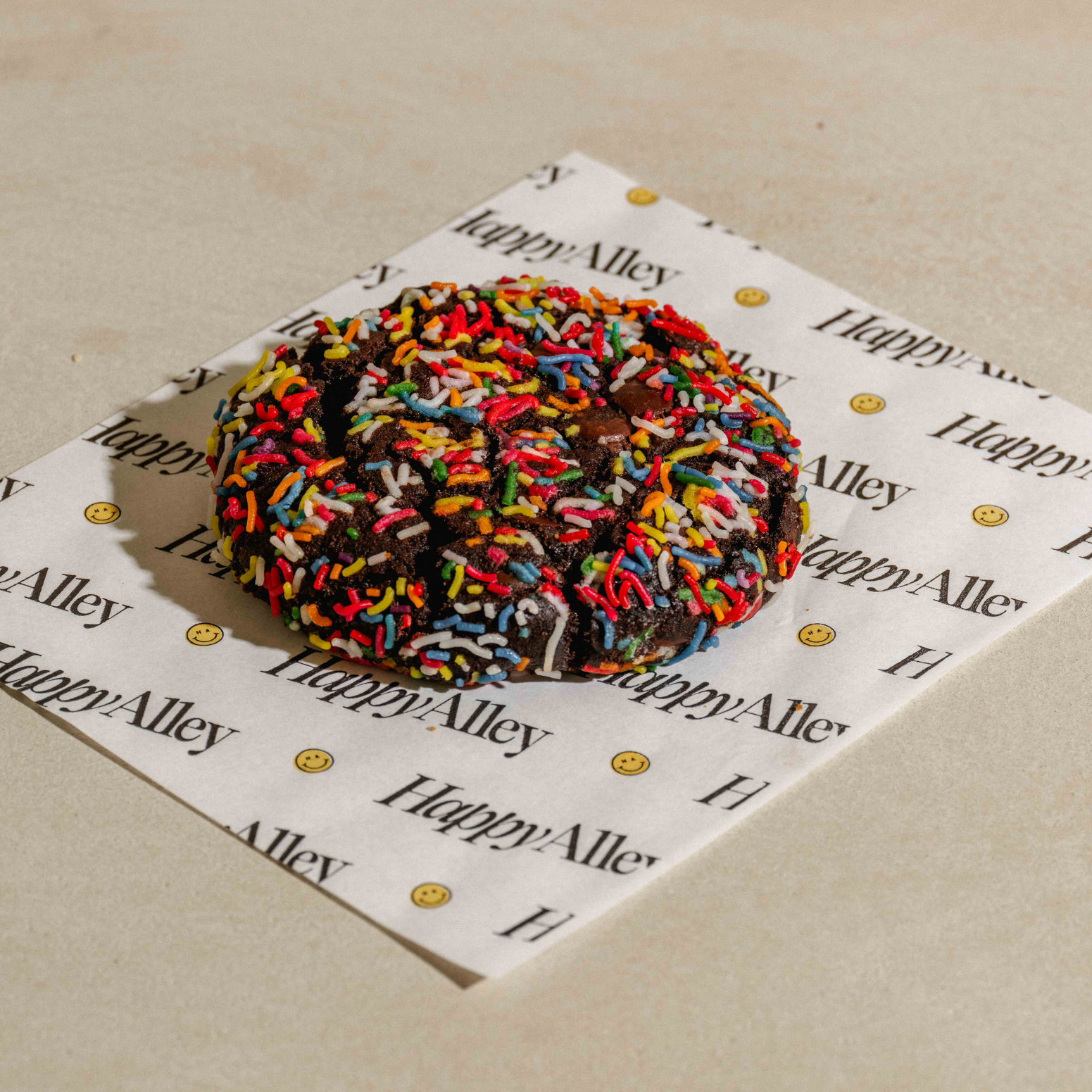 Birthday Cake Cookie on a Happy Alley branded paper on a beige surface