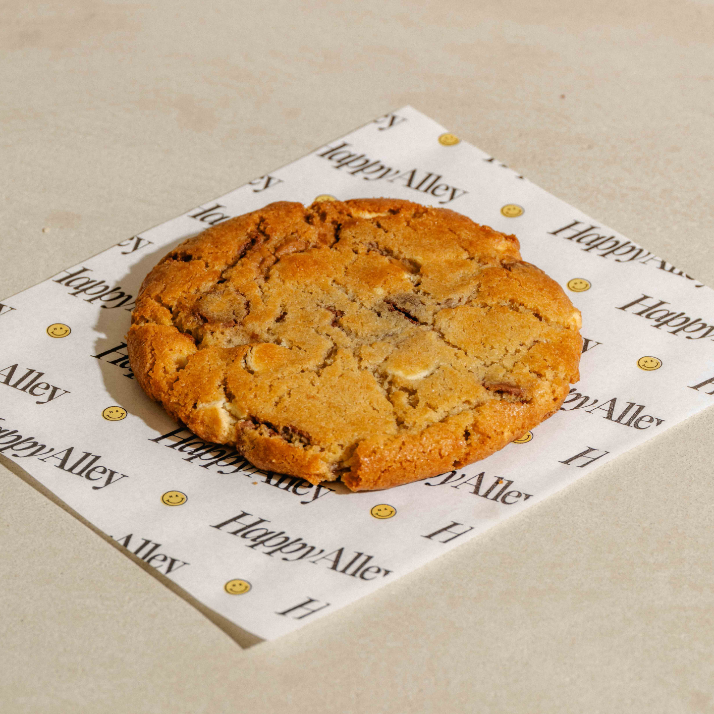 Biscoff Cookie on a branded paper with a neutral background